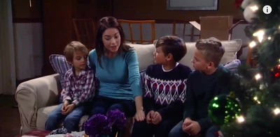 Aiden with his mom and brothers on Christmas