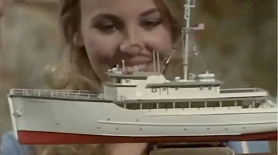 Laura Webber with a model of The Haunted Star Yacht. (1981)