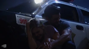 Nathan shields Maxie during the explosion