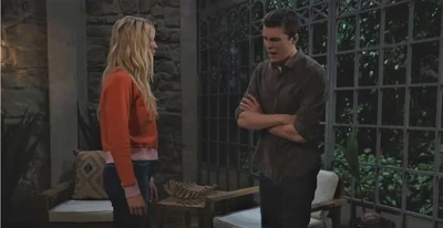 Cameron Webber and Josslyn chat on the deck of the Beach House (2021)
