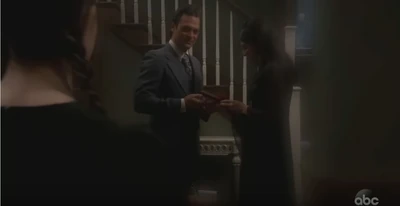 Young Natasha and her mother Kristin get a visit from her father Mikkos at Christmas