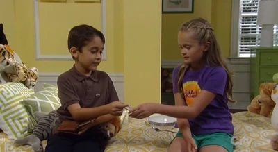 Spencer shows Josslyn a picture of his mom, Courtney