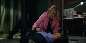 Maxie tends to Nathan after he was shot