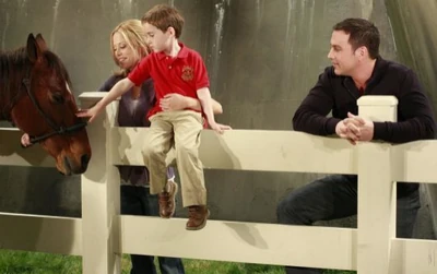 Spencer with his father, Nadine and a horse