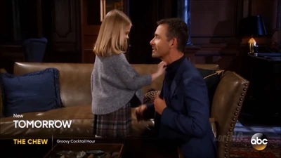 Charlotte helping her father with his tie