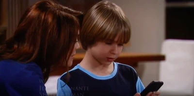 Elizabeth shows Jake a pic of his baby sister