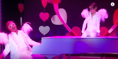 Ned and Emma perform a duet to "Don't Go Breaking My Heart"