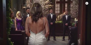 Julian watches Alexis walk down the aisle