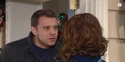 Almost kiss under the mistletoe