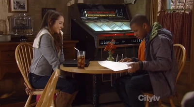 Molly tells T.J. about her book (2012)