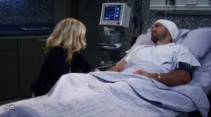 Maxie sits with Nathan after he was injured