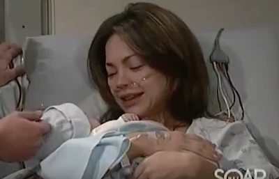 Elizabeth holds baby Jake for the first time