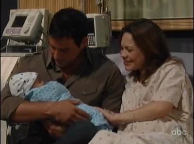 Nikolas holds baby Aiden