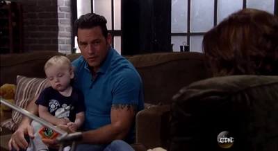 Rocco falls asleep on his uncle's lap