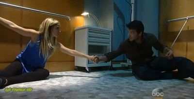 Dante and Lulu hold hands while handcuffed (2014)