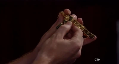 Peter holds stolen Aztec necklace (2014)