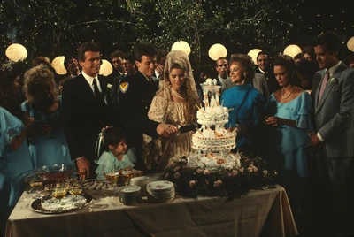 Frisco and Felicia wed in the backyard of the Brownstone. (1986)