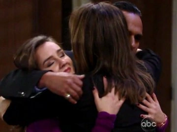 Kristina hugs her parents