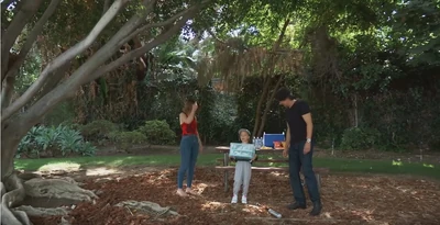 Aunt Elizabeth, niece Violet Finn (with cousin Aiden Spencer's cupcakes), and dad Hamilton Finn in the park for her t-ball game (2021)
