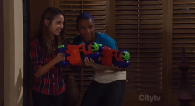 Molly and T.J. with water guns (2012)