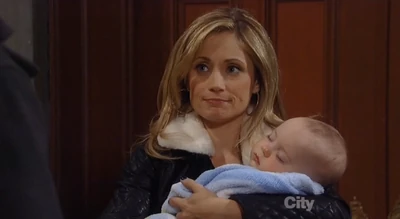 Rocco sleeping in his mother's arms