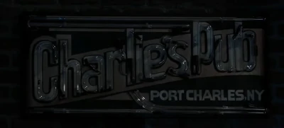 The darkened sign at the Pub, after Julian's death (2021)