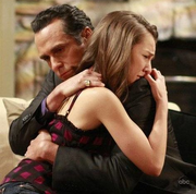 Kristina is comforted by her father