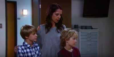 With his step-mom and brother