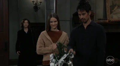 Nik and Esme celebrating Christmas with Liz looking on (2022)