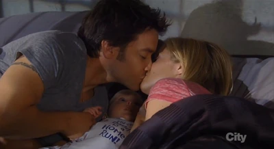 Dante and Lulu kiss with Rocco in between them
