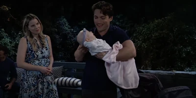 Michael holds Daisy as Sasha watches (2025)