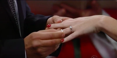 Dante puts the ring on Lulu's finger (2011)