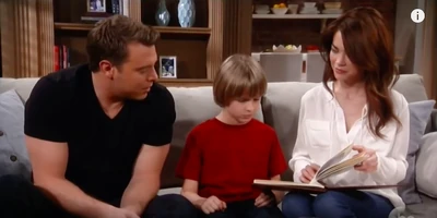 Jason and Elizabeth show Jake pictures