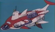 An X-Ray diagram of the Dolphin II's weapons. On the dorsal top the ship are the rocket launchers, the "belly" houses the missile and torpedo bays and the bow/nosecone of the ship is equipped with a high-tech heat ray energy weapon.