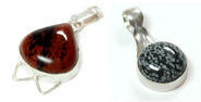 Mahogany obsidian and snowflake obsidian cabochons set in a sterling silver pendants.