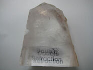 Transparent calcite (known as "Iceland Spar") from Chihuahua, Mexico. This specimen shows excellent double refraction. Specimen is about four inches (ten millimeters) across .