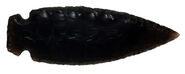 A spear point fashioned from opaque black obsidian