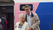 Godelieve Voet July 2019.jpg (75 KB) Voet (aged 104) with her grandson before boarding the train to Lourdes in July 2019