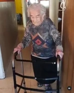 Benegas using a walker at the age of 112.