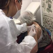 Cristina Paloscia vaccine.jpg (43 KB) Aged 108, receiving the COVID-19 vaccine in March 2021