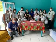 Auta Pinto da Silva on her 112th birthday in 2023, celebrating with her family.