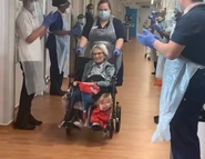 ConnieTitchenHospital.png (1.6 MB) Titchen being applauded by hospital staff as she is discharged from Birmingham City Hospital in April 2020