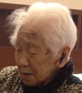 Tanaka (aged 110) in 2013.