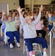 Smith performs exercises at the Naples Estates Community Center at age 105.