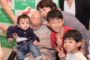 Tajima (aged 117) with three of her great-great-grandsons.