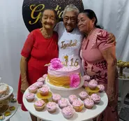 Isabel de Sena (center) celebrating her claimed 115th birthday in June 2022.