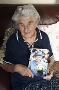 Elsie (aged 101) holding a photo of the Queen Elizabeth ii