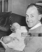Lawler (right, age 36) holding his 2 twin sons Martin and Adam on June 12, 1957.