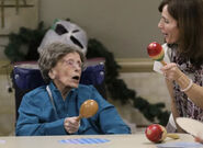 Dunlap participating in a maraca-shaking activity on her 114th birthday