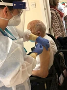Beiso receiving his first dose of the Pfizer/BionTech vaccine on 11 January 2021 at the age of 100